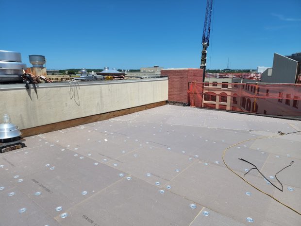 Parapet and completed roof field on an institutional building.