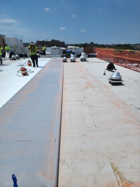 Membrane run terminating into metal edge detail.