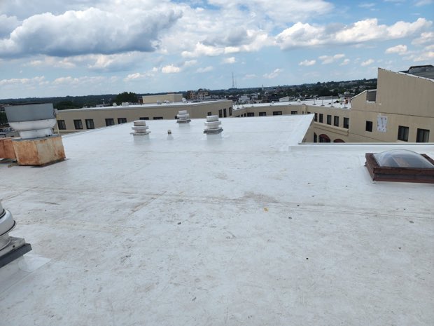 Roof hatches set into a completed reflective field.