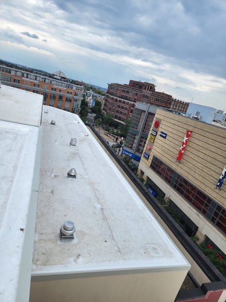Roof edge above an urban street.