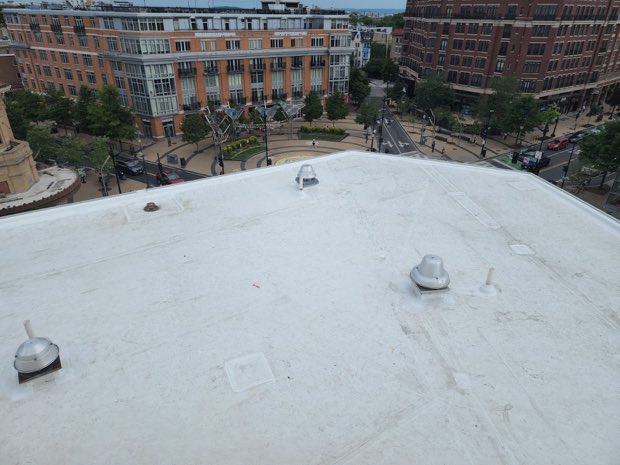 Vents set across a completed white roof.