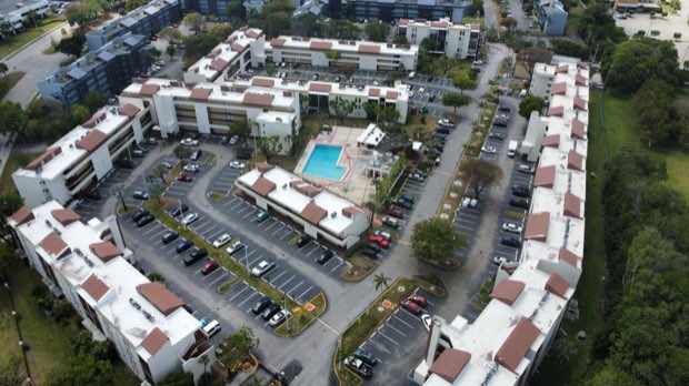 Residential community aerial — roof inventory and access routes visible.