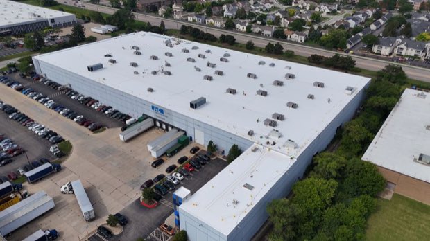 Distribution warehouse roof, reflective membrane and loading apron.